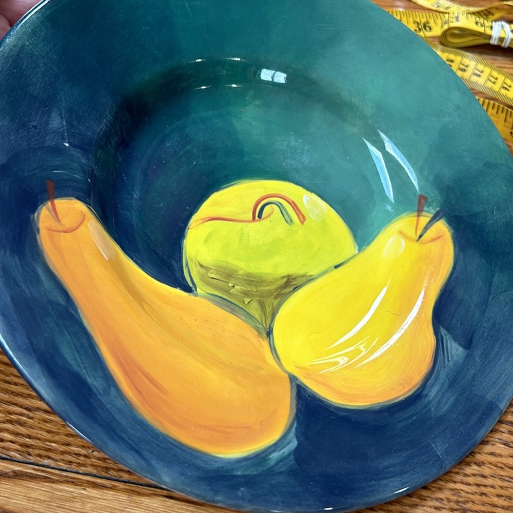 Blue, green and yellow ceramic painted fruit bowls. Pottery Barn pattern.